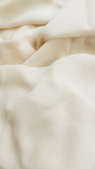 For a timeless and elegant look, consider using a white or beige fabric as a background for product photography.