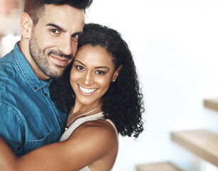 Hugging, love and affection couple loving, happy and smiling. Interracial boyfriend and girlfriend bonding together, dating and feeling positive. Portrait of cheerful married man and woman embracing