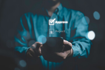 Businessman using smart phone to tick correct sign mark on approve check box for quality document and project approval concept.