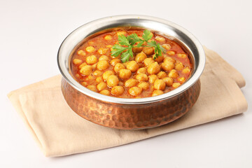 Chole or Chick pea curry  served in a copper bowl