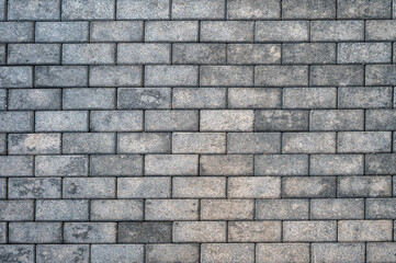Paving stones on the footpath as background.