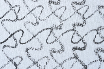 overlapping wavy lines on textured paper