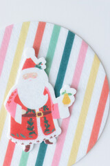 retro felt holiday Santa Claus on a felt circle with stripes