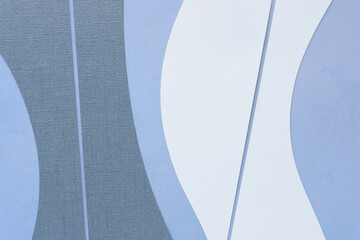 abstract background featuring textured and patterned cut blue and white paper