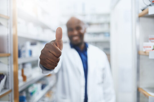 Pharmacy, doctor and black man with hand for thumbs up, approval and thank you for customer service. Healthcare, pharmacist and smile with yes for medicine, prescription and success for promotion