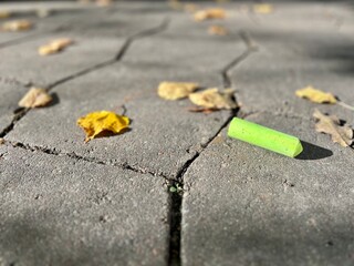 school children's colored chalk on the asphalt on the ground on an autumn warm sunny day as a background the beginning of school days