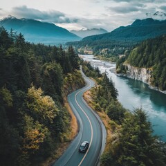 Scenic drive through lush green mountains along a serene river