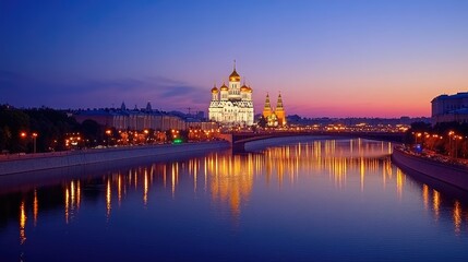 Obraz premium The golden-domed Cathedral of Christ the Savior reflected in the Moscow River at sunset.