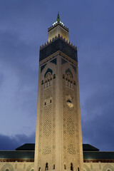 Fototapeta premium Casablanca, Morocco : The minaret, or tower, of the Hassan II mosque, also called the Great Mosque. Night picture, black sky.
