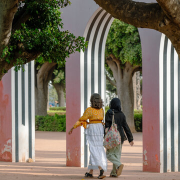 Casablanca, Morocco. Moroccan two young Moroccan girls walking in the parc de la ligue arabe. English : The Arab League Park.