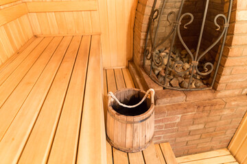 interior of a sauna with big stone oven