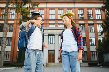 Portrait of smiling school kids standing at school yard
