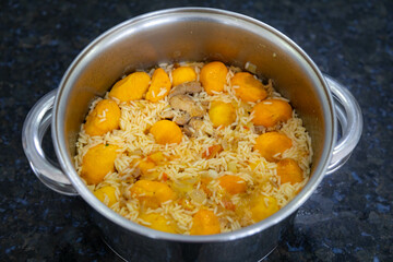 Traditional Brazilian dish rice, chicken and pequi (caryocar brasileinse) known as galinhada goiana
