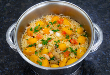 Traditional Brazilian dish rice, chicken and pequi (caryocar brasileinse) known as galinhada goiana