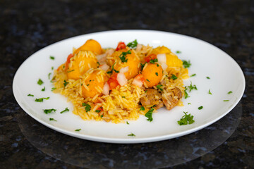 Traditional Brazilian dish rice, chicken and pequi (caryocar brasileinse) known as galinhada goiana