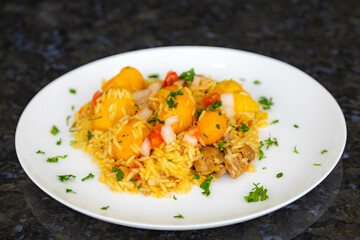 Traditional Brazilian dish rice, chicken and pequi (caryocar brasileinse) known as galinhada goiana