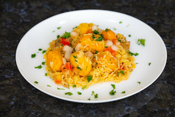 Traditional Brazilian dish rice, chicken and pequi (caryocar brasileinse) known as galinhada goiana