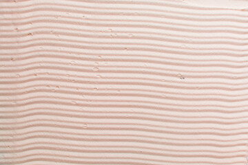 Top view of pink buttercream for decorating cake, silky smooth american buttercream with patterns, overhead view of smooth buttercream