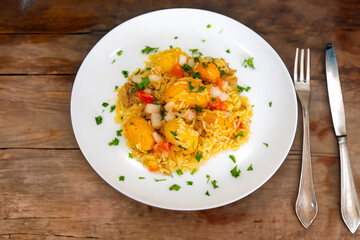 Traditional Brazilian dish rice, chicken and pequi (caryocar brasileinse) known as galinhada goiana