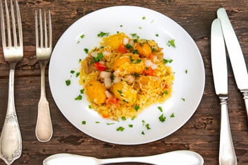 Traditional Brazilian dish rice, chicken and pequi (caryocar brasileinse) known as galinhada goiana