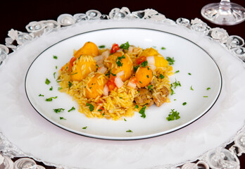 Traditional Brazilian dish rice, chicken and pequi (caryocar brasileinse) known as galinhada goiana