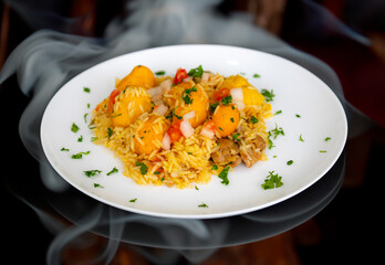 Traditional Brazilian dish rice, chicken and pequi (caryocar brasileinse) known as galinhada goiana