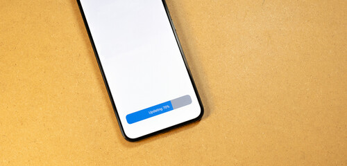 Smartphone OS update in progress, 70% completed on modern mobile device, application software...