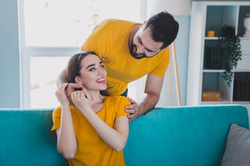 Photo of two young partners embrace look each other free time modern interior apartment indoors
