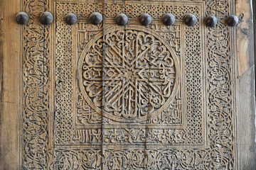 Old wooden carved door. Khiva. Uzbekistan