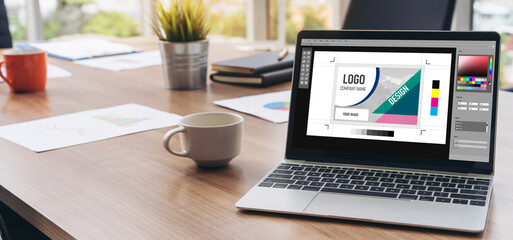 Graphic designer software for modern design of web page and commercial ads showing on the computer screen