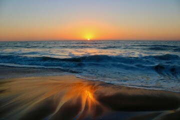 Eternal Glow: Sunset's Embrace on Golden Beach 