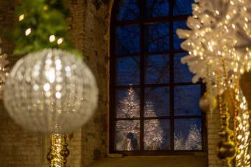 Decorative lights and sparkling ornaments, a festive atmosphere near a window showcasing Christmas...