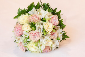 Tender and beautiful Wedding bouquet of white and pink flowers on a pink background