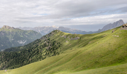 Belvedere mountain shelter on green slopes, Canazei, Italy