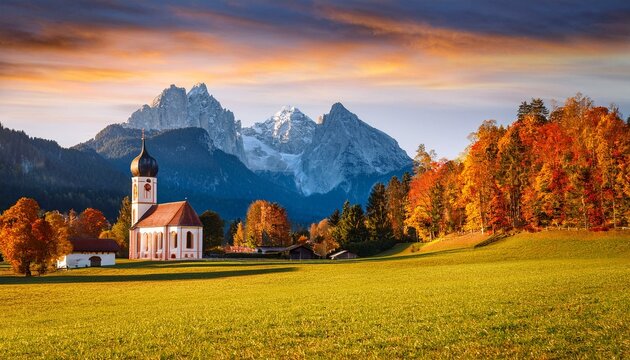 iconic picture of bavaria with maria gern church with hochkalter peak on background fantastic autumn sunrise in alps superb evening landscape of germany countryside traveling concept background