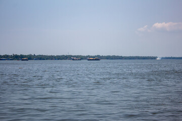View of Vambanad lake from the houseboat cruise along the Alappuzha backwaters in the indian state of Kerala.