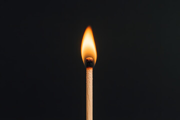 burning match on black background