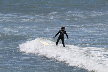 Surfer on the Malibu beach, Southern California