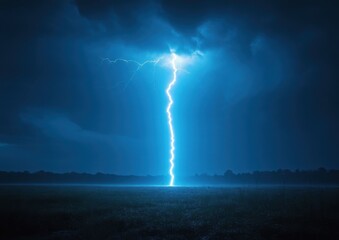A powerful bolt of lightning strikes across a dark, stormy night sky.