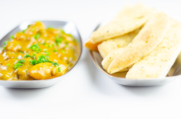 A plate of food with a side of bread