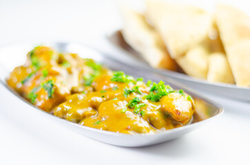 A plate of food with a side of bread