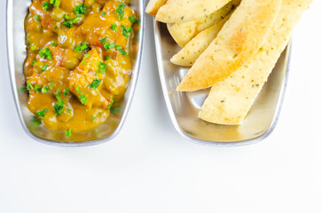 A plate of food with a side of bread
