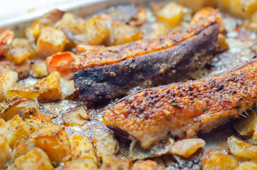 A plate of food with meat and vegetables on it