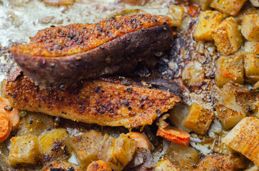 A plate of food with meat and vegetables on it