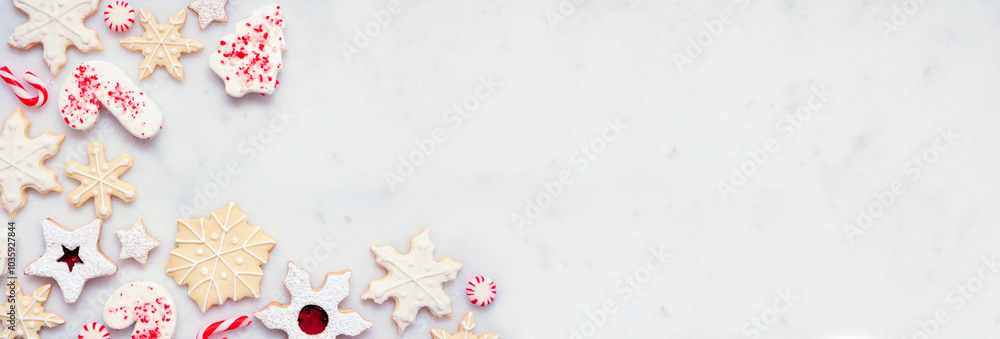 Poster christmas baking corner border with a variety of red and white theme cookies and candies. above view