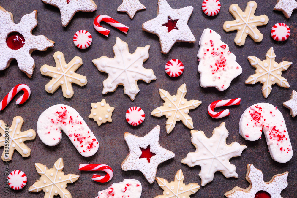 Poster christmas baking background with a collection of red and white theme cookies and candies. above view