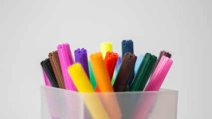 Colorful Markers in Transparent Holder Close-Up