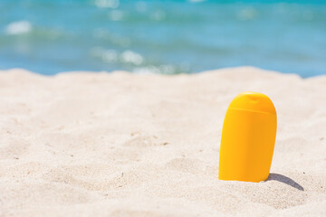 Sunscreen bottle on the beach