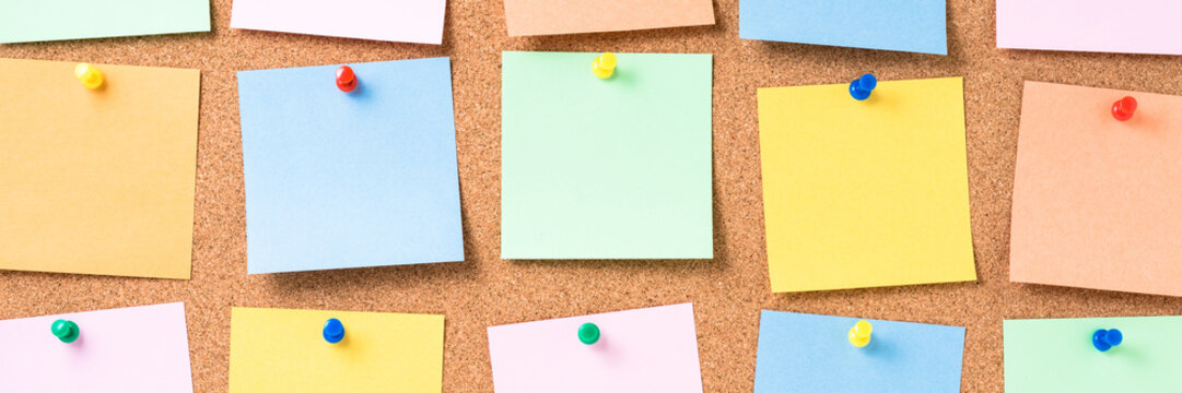 Cork board with colorful blank notes