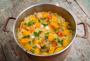 Traditional Brazilian dish rice, chicken and pequi (caryocar brasileinse) known as galinhada goiana